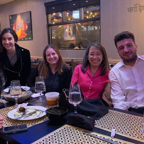 Students at dinner smile for the picture
