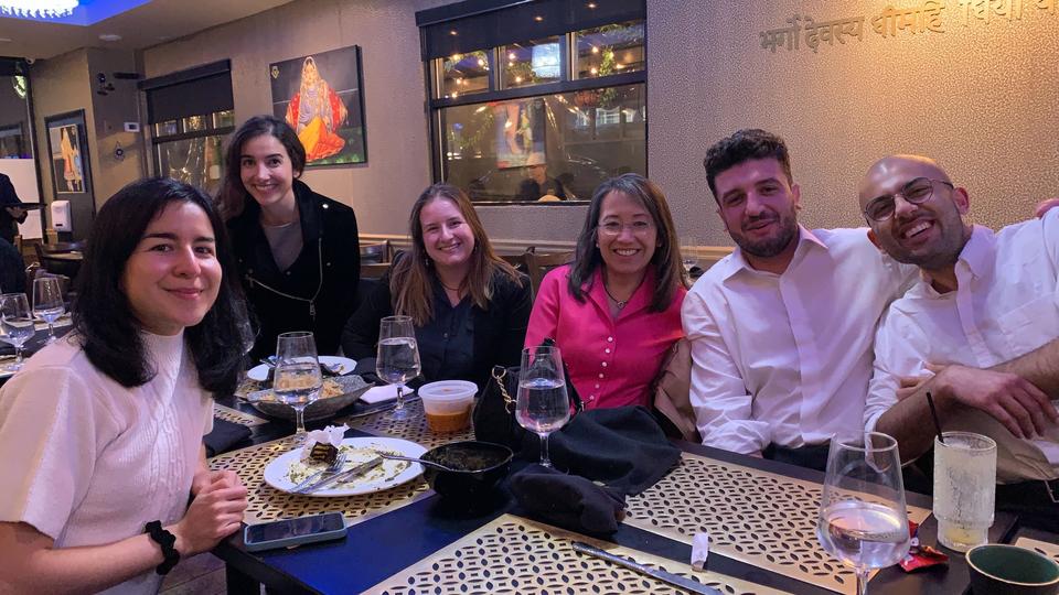 Students at dinner smile for the picture